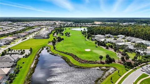 a view of a swimming pool with a yard