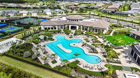 an aerial view of an houses and outdoor space