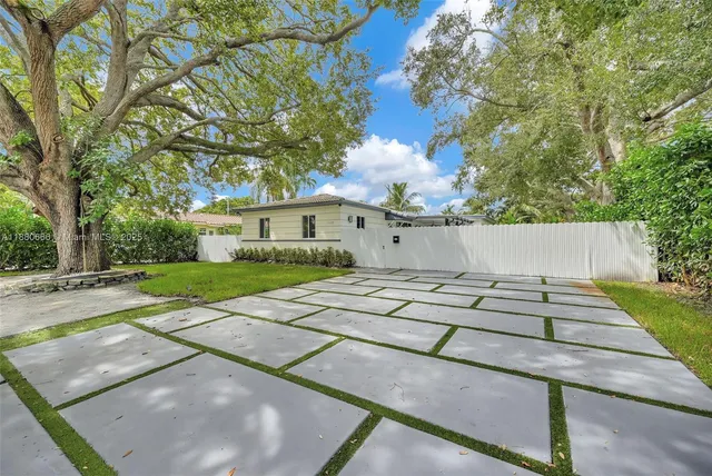 a view of house with backyard space