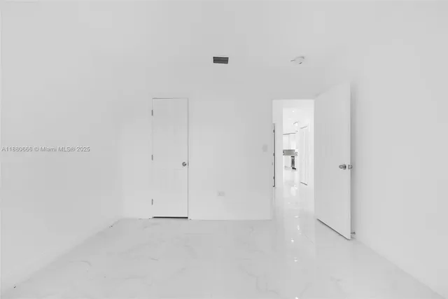 a bathroom with a granite countertop sink a mirror and a bathtub