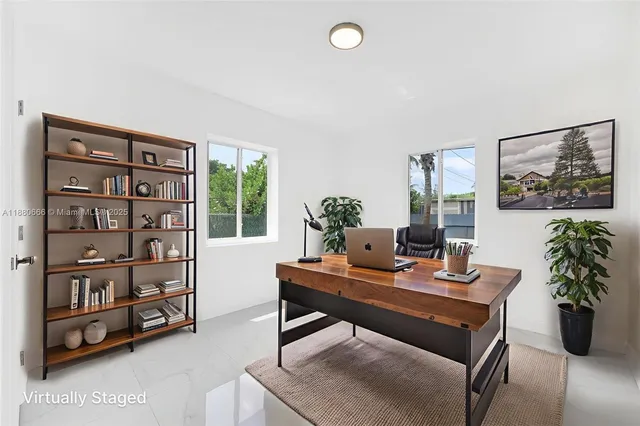 a workspace with furniture and window