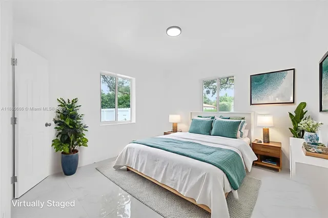 a bedroom with a bed and a couch