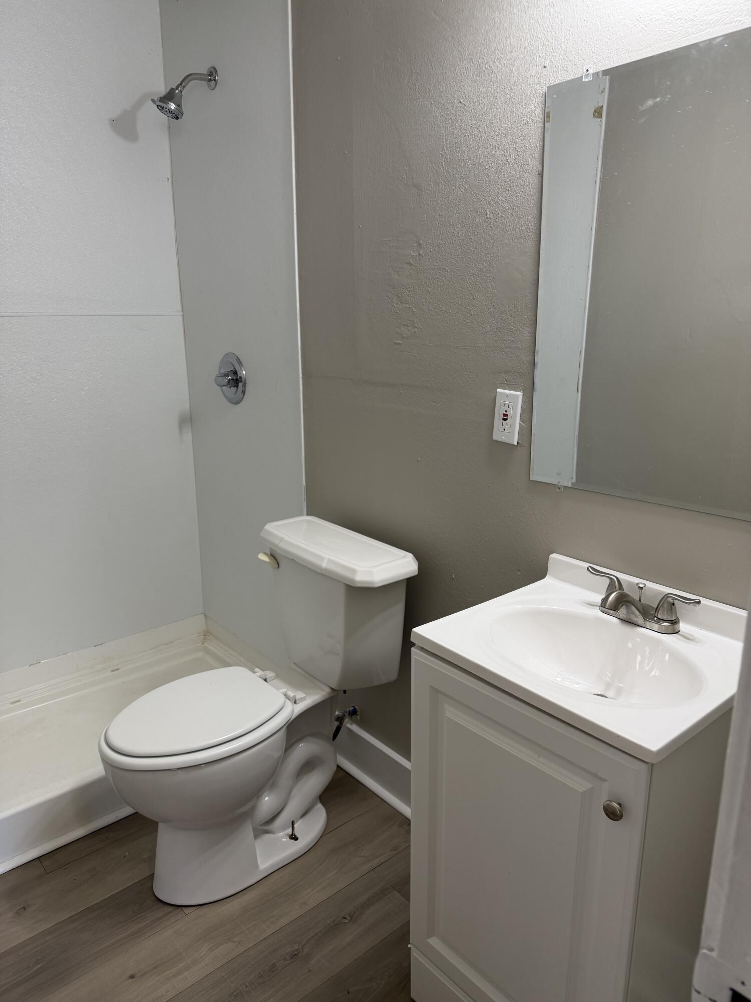 2906 Beech Avenue Lubbock, TX 79404 - Photo 8 of 10 a bathroom with a sink toilet and a mirror