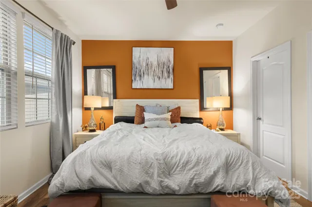 a bedroom with a bed and a window