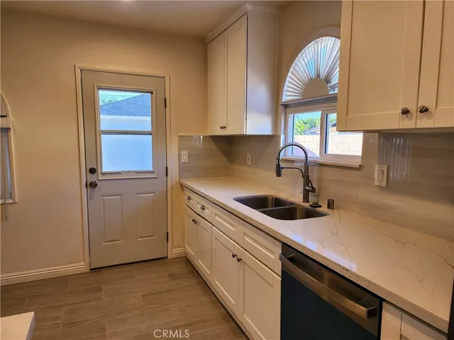 a kitchen with a sink and a window