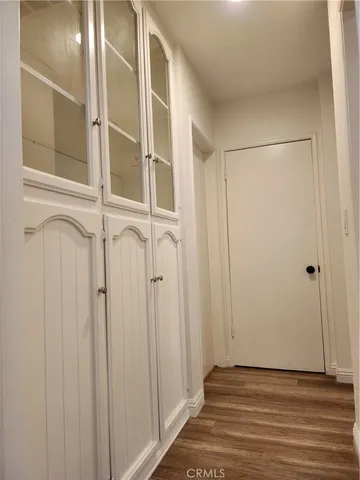 a bathroom with a sink and mirror with shower