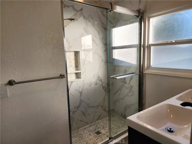 a bathroom with a sink and a shower