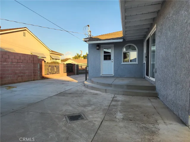 a front view of a house with a yard and a garage