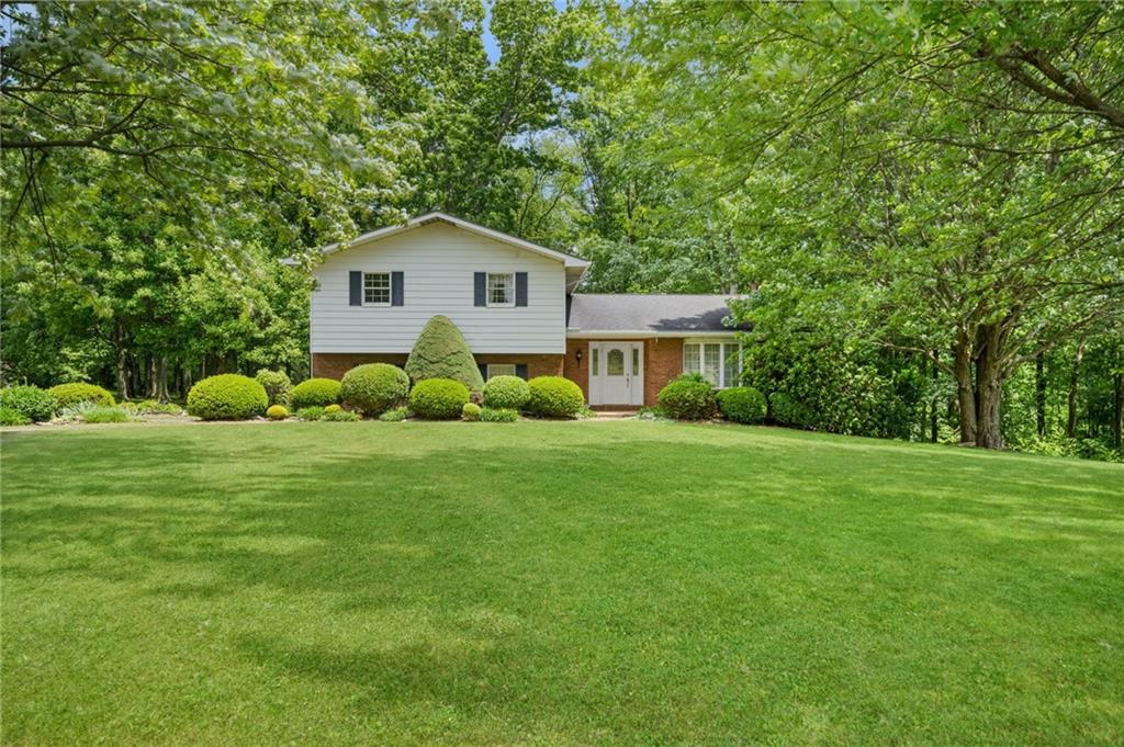 338 Hellein School Road Donegal, PA 15628 - Photo 1 of 46 a house view with a garden space