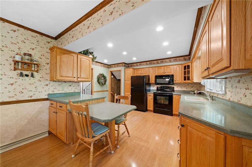 338 Hellein School Road Donegal, PA 15628 - Photo 18 of 46 a kitchen with stainless steel appliances granite countertop a sink a stove and refrigerator