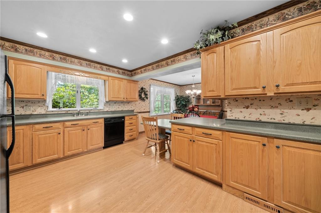 338 Hellein School Road Donegal, PA 15628 - Photo 20 of 46 a kitchen with stainless steel appliances granite countertop a stove sink and cabinets