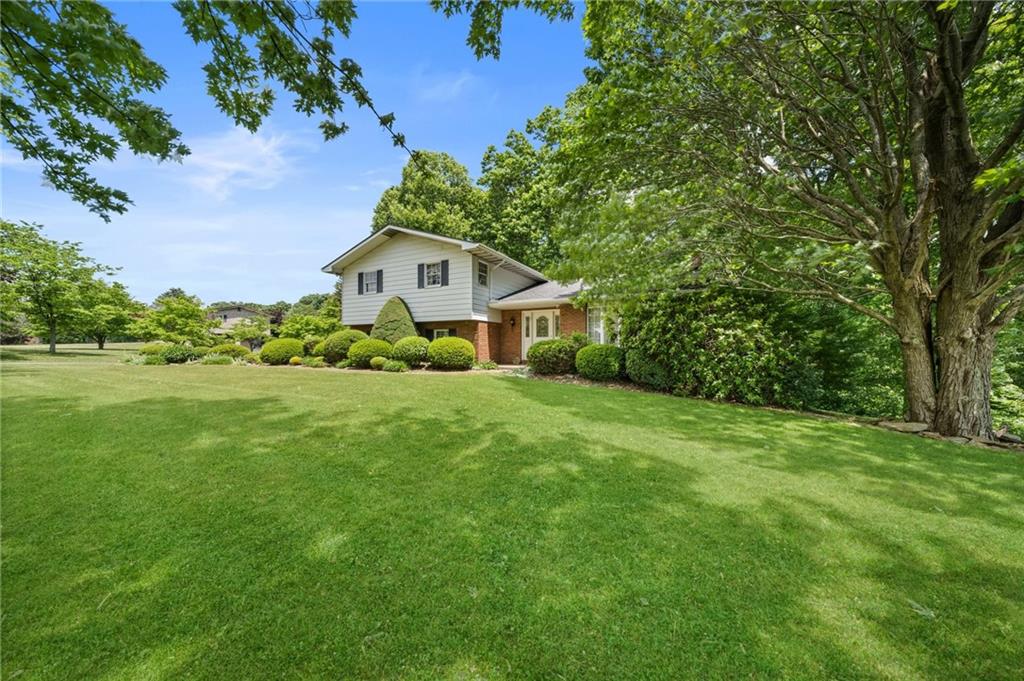338 Hellein School Road Donegal, PA 15628 - Photo 2 of 46 a front view of a house with a yard