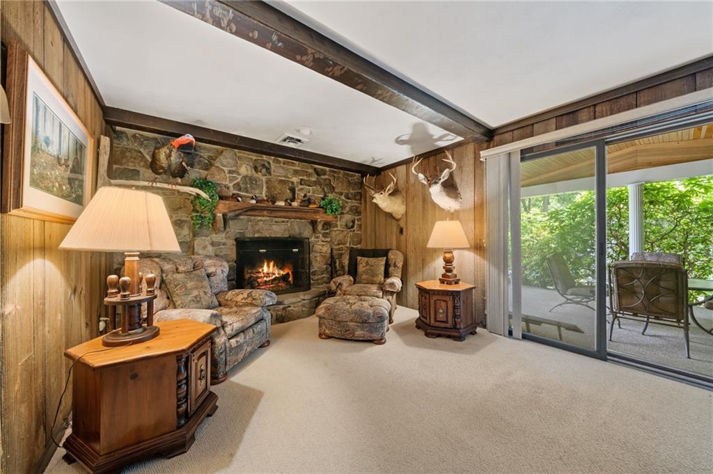 338 Hellein School Road Donegal, PA 15628 - Photo 26 of 46 a living room with furniture a fireplace and a large window