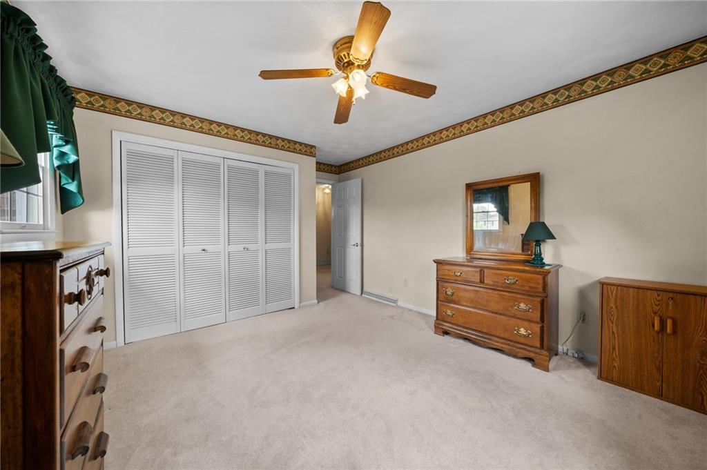 338 Hellein School Road Donegal, PA 15628 - Photo 29 of 46 a view of an empty room with a chandelier fan and a window