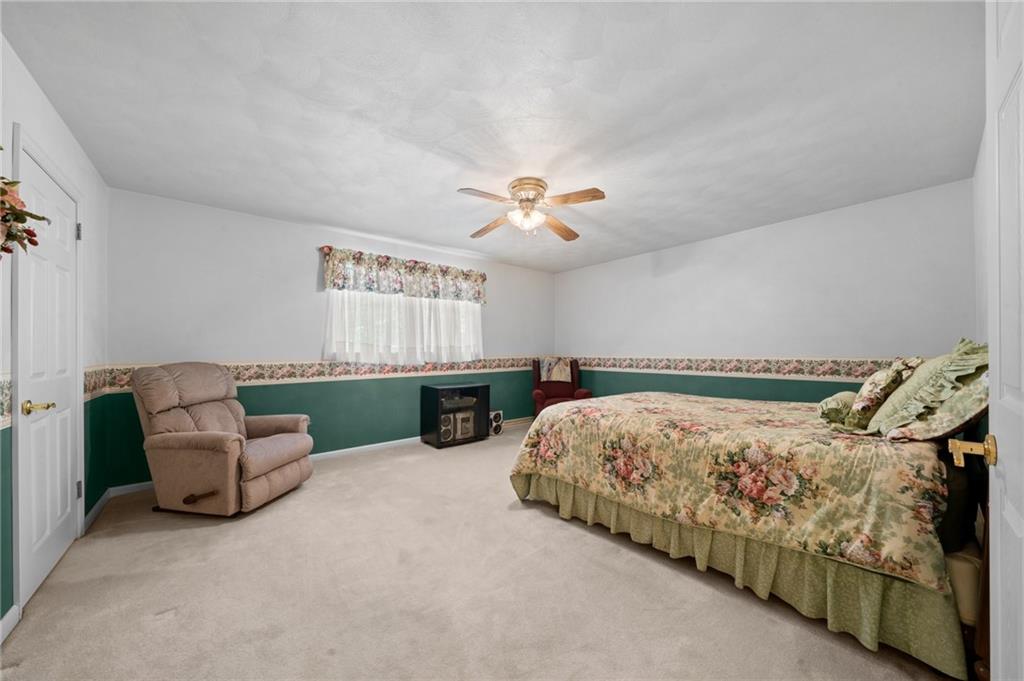 338 Hellein School Road Donegal, PA 15628 - Photo 35 of 46 a bed room with furniture and a chandelier