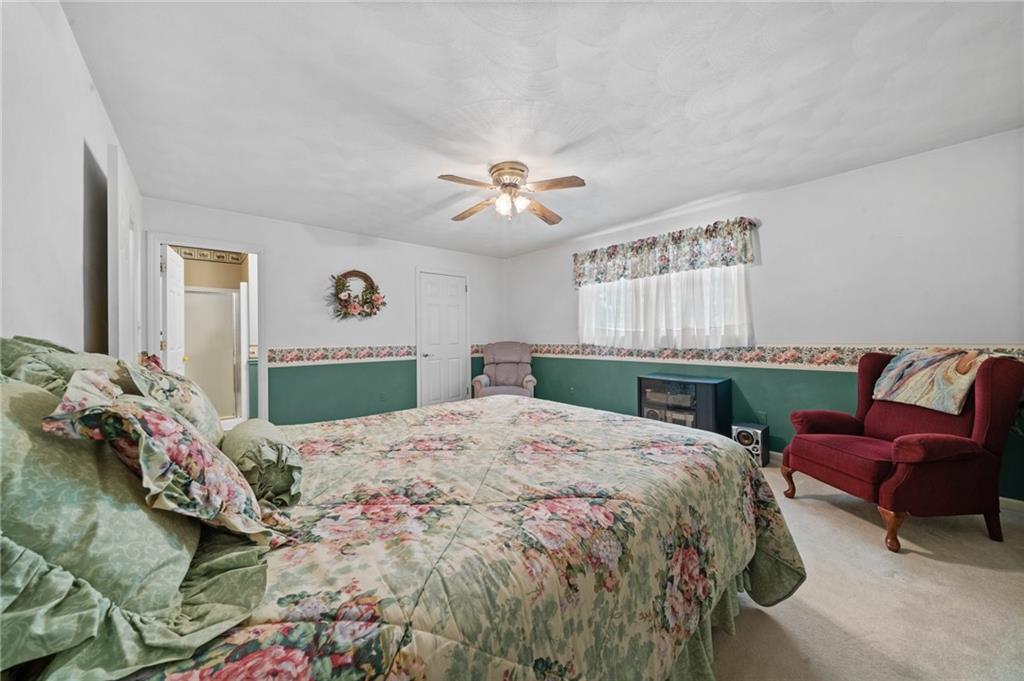 338 Hellein School Road Donegal, PA 15628 - Photo 37 of 46 a bedroom with a bed and a couch