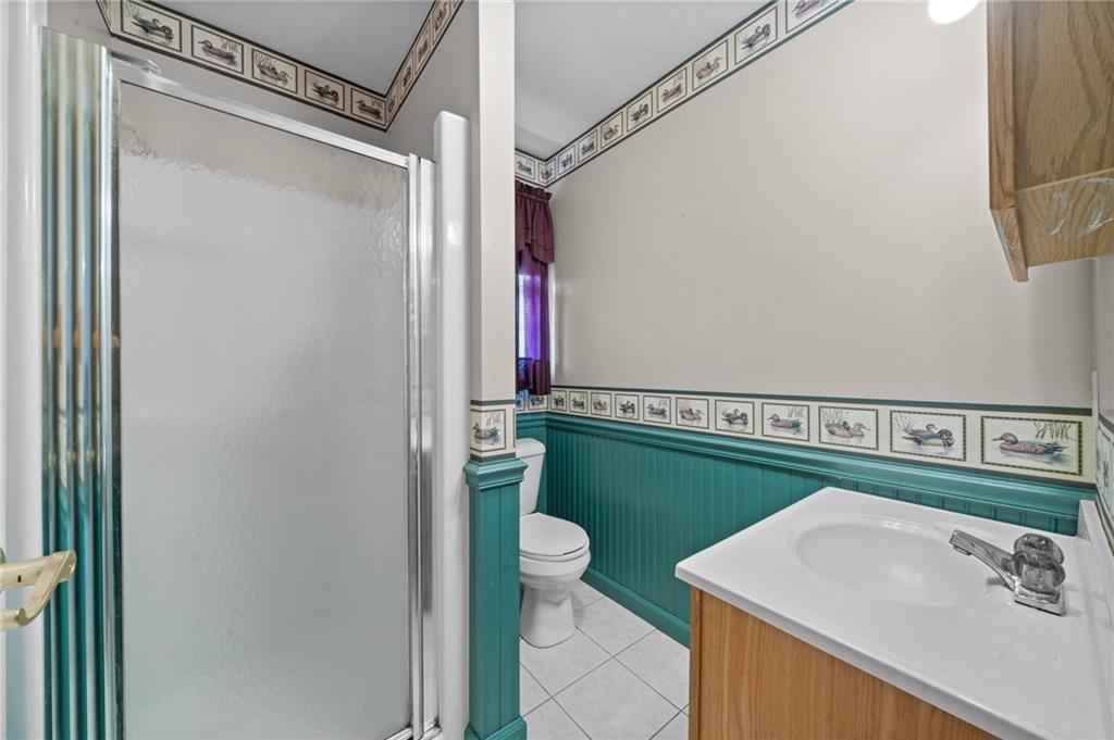 338 Hellein School Road Donegal, PA 15628 - Photo 38 of 46 a bathroom with a sink a toilet and a mirror