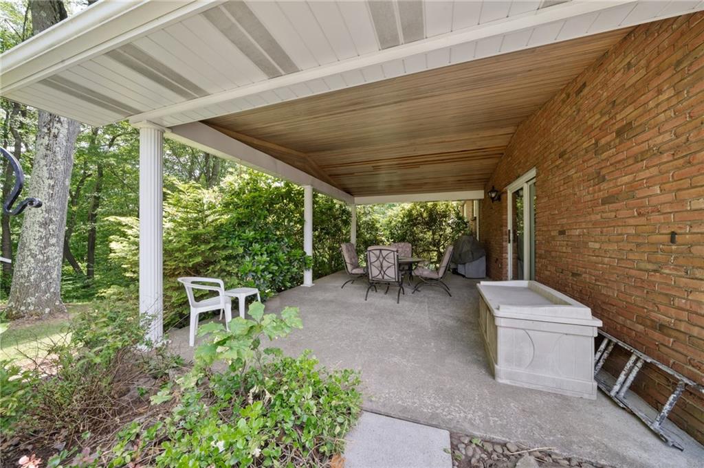 338 Hellein School Road Donegal, PA 15628 - Photo 40 of 46 a view of a patio with table and chairs and potted plants