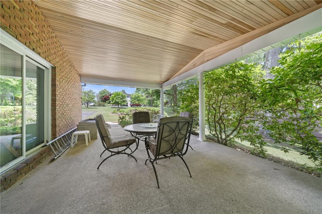 338 Hellein School Road Donegal, PA 15628 - Photo 41 of 46 a view of a patio with table and chairs and potted plants