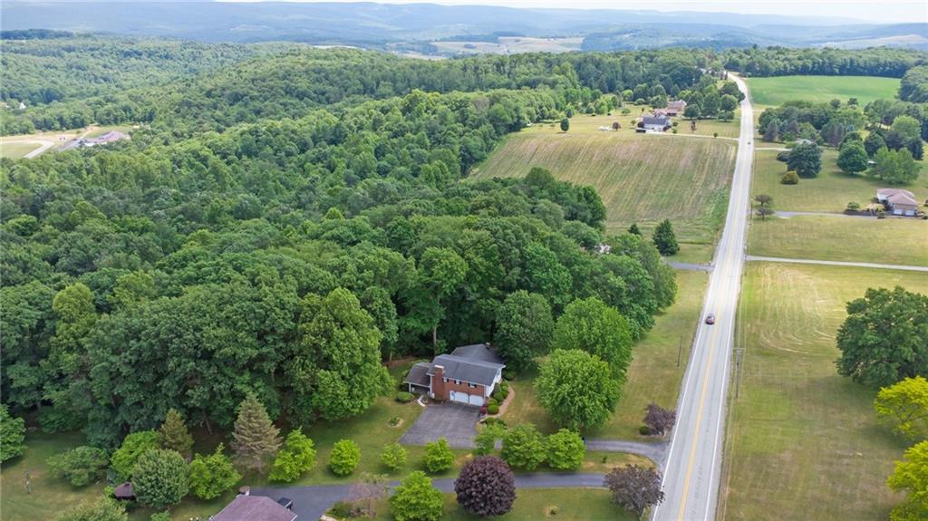 338 Hellein School Road Donegal, PA 15628 - Photo 45 of 46 an aerial view of a house with yard and outdoor seating