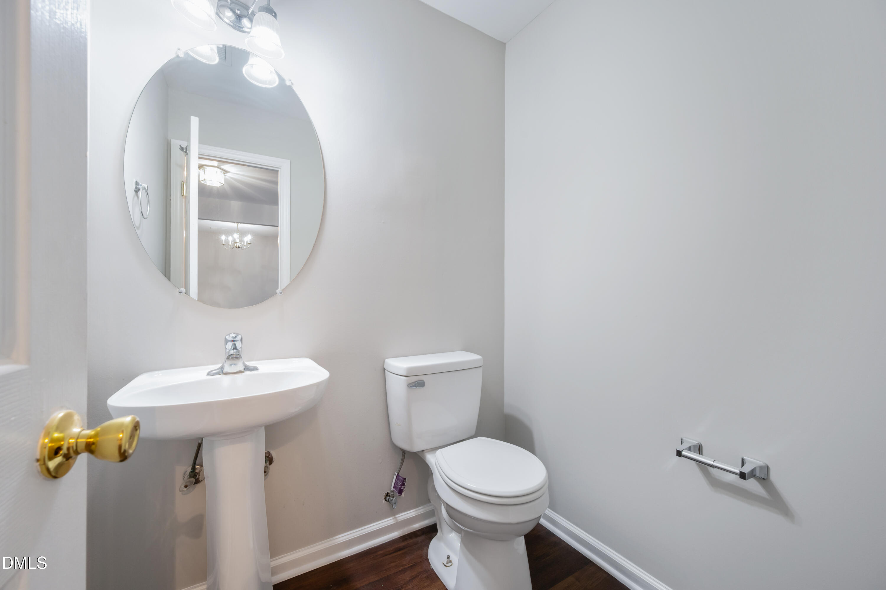 1532 Pebble Ridge Drive Raleigh, NC 27610 - Photo 22 of 40 a bathroom with a sink and mirror with toilet