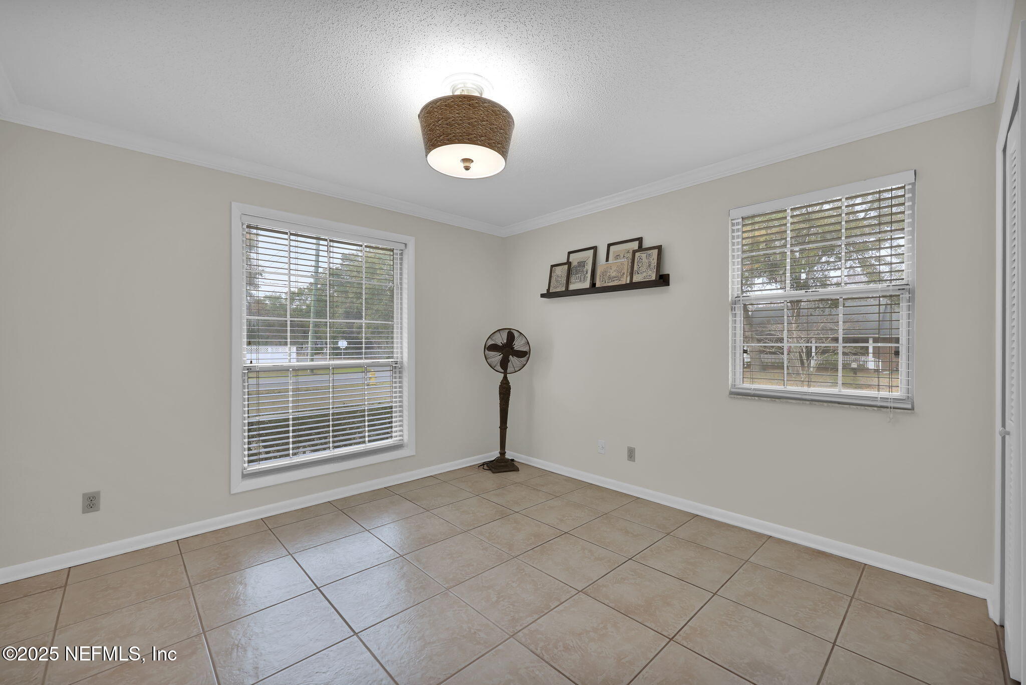 4607 Seaboard Avenue Jacksonville, FL 32210 - Photo 12 of 18 an empty room with windows