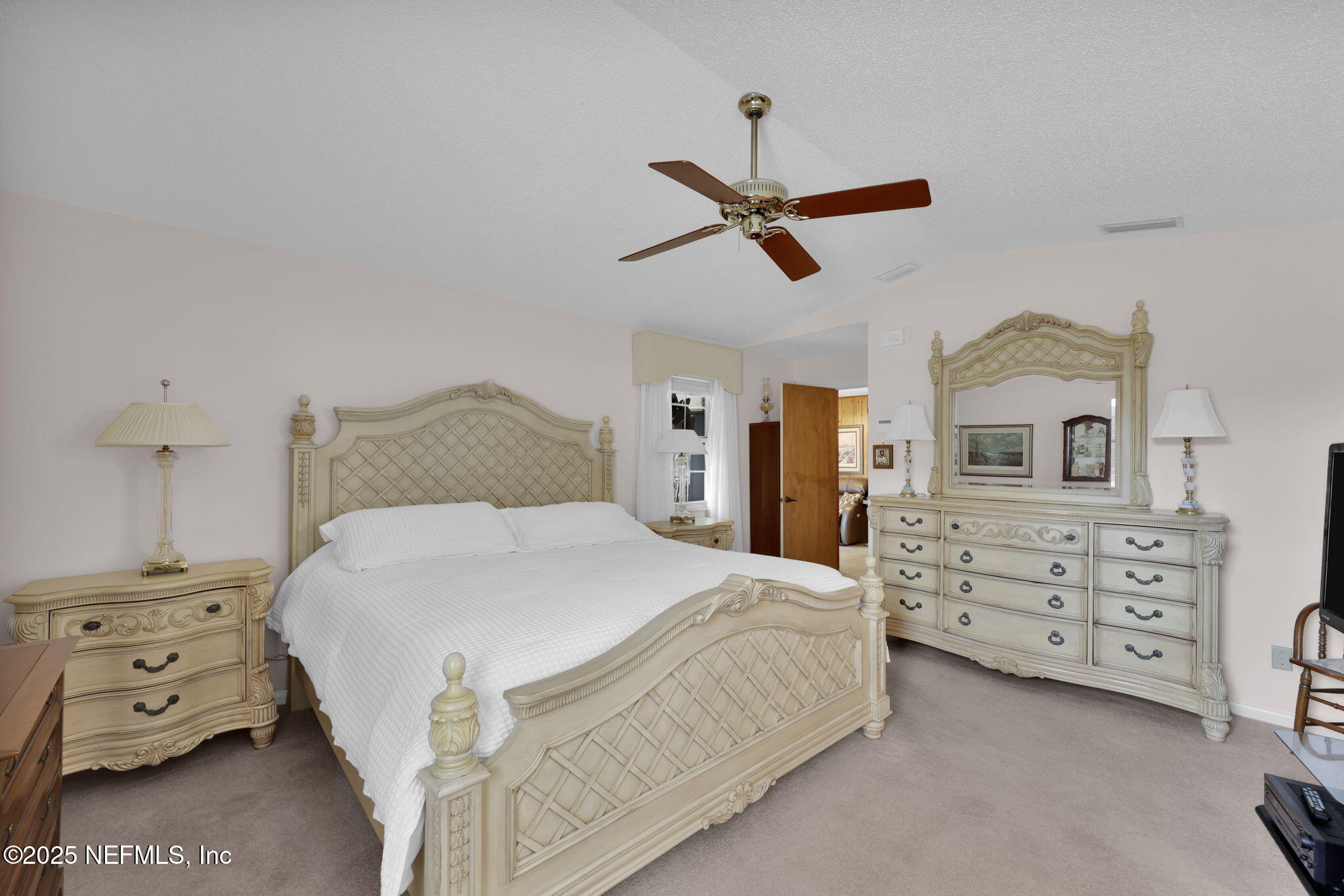 4607 Seaboard Avenue Jacksonville, FL 32210 - Photo 14 of 18 a bedroom with a bed and a dresser