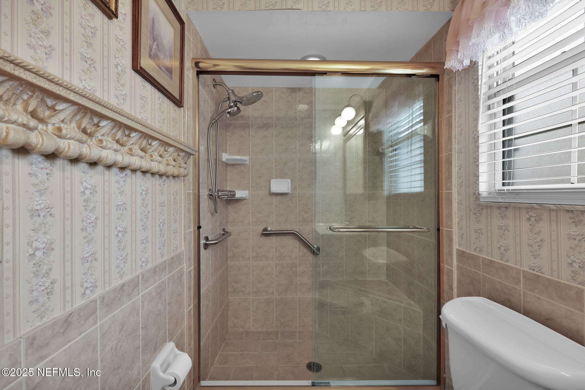 4607 Seaboard Avenue Jacksonville, FL 32210 - Photo 15 of 18 a bathroom with a glass door shower