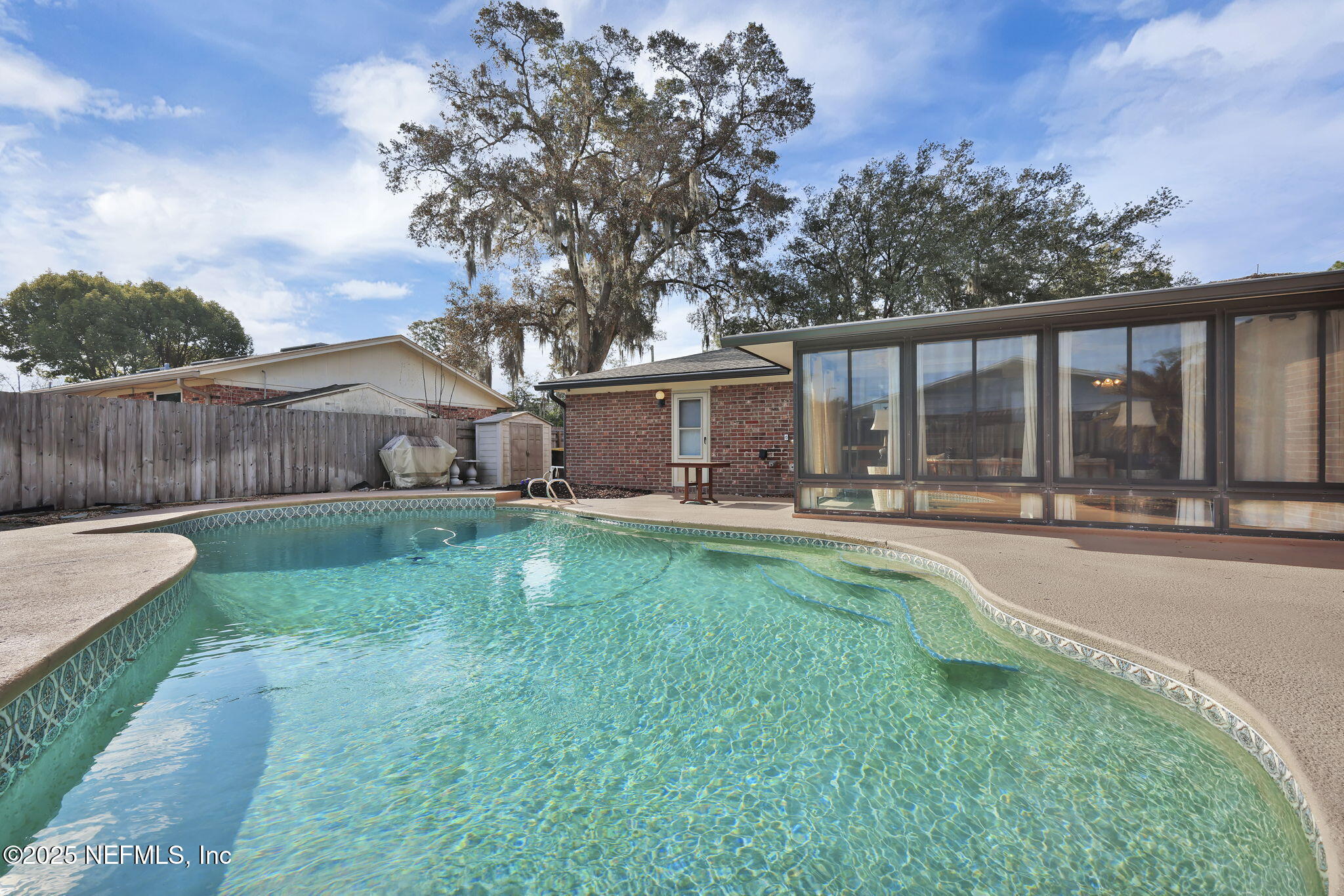 4607 Seaboard Avenue Jacksonville, FL 32210 - Photo 18 of 18 a view of a house with backyard and porch
