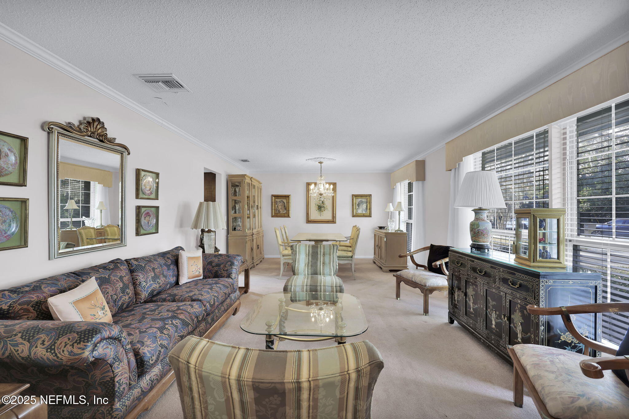 4607 Seaboard Avenue Jacksonville, FL 32210 - Photo 4 of 18 a living room with furniture large windows and wooden floor
