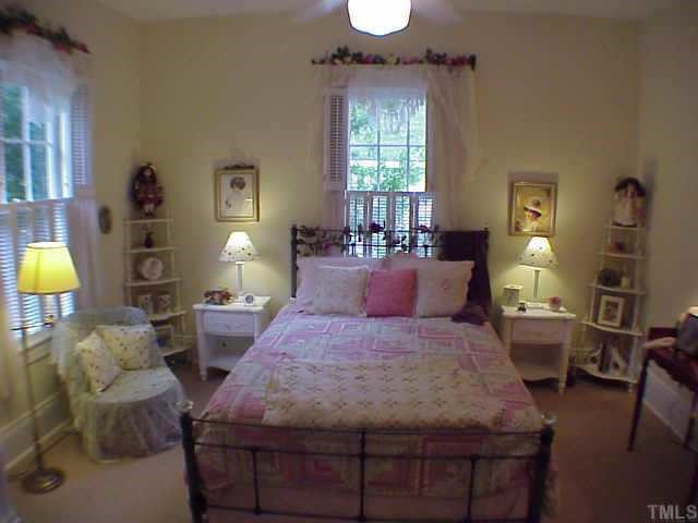 311 Cutler Street Raleigh, NC 27603 - Photo 8 of 10 The windows are shuttered top and bottom throughout. This is the back BR. Other