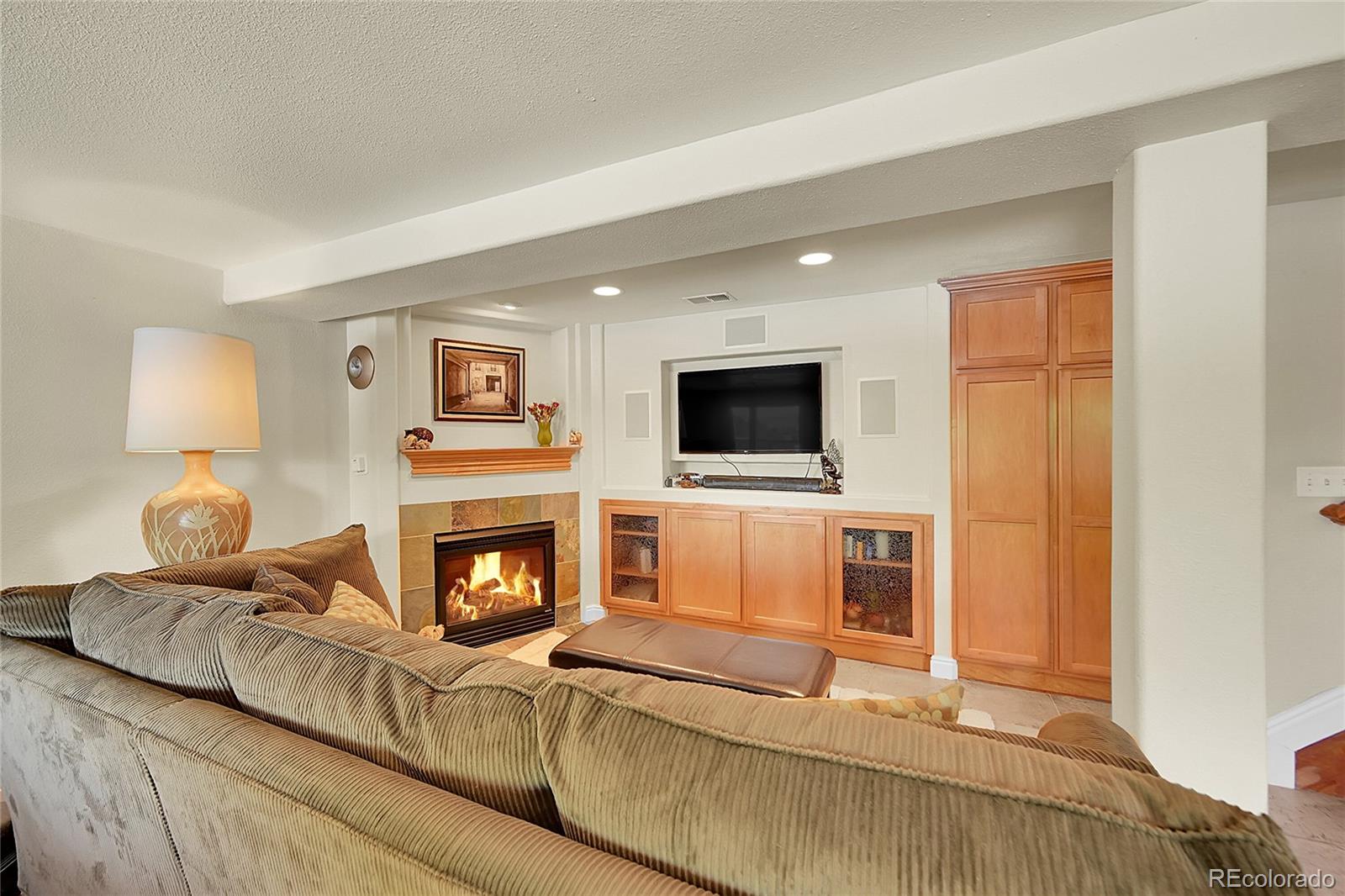 1500 West Ridge Road Littleton, CO 80120 - Photo 20 of 49 a living room with furniture and a fireplace