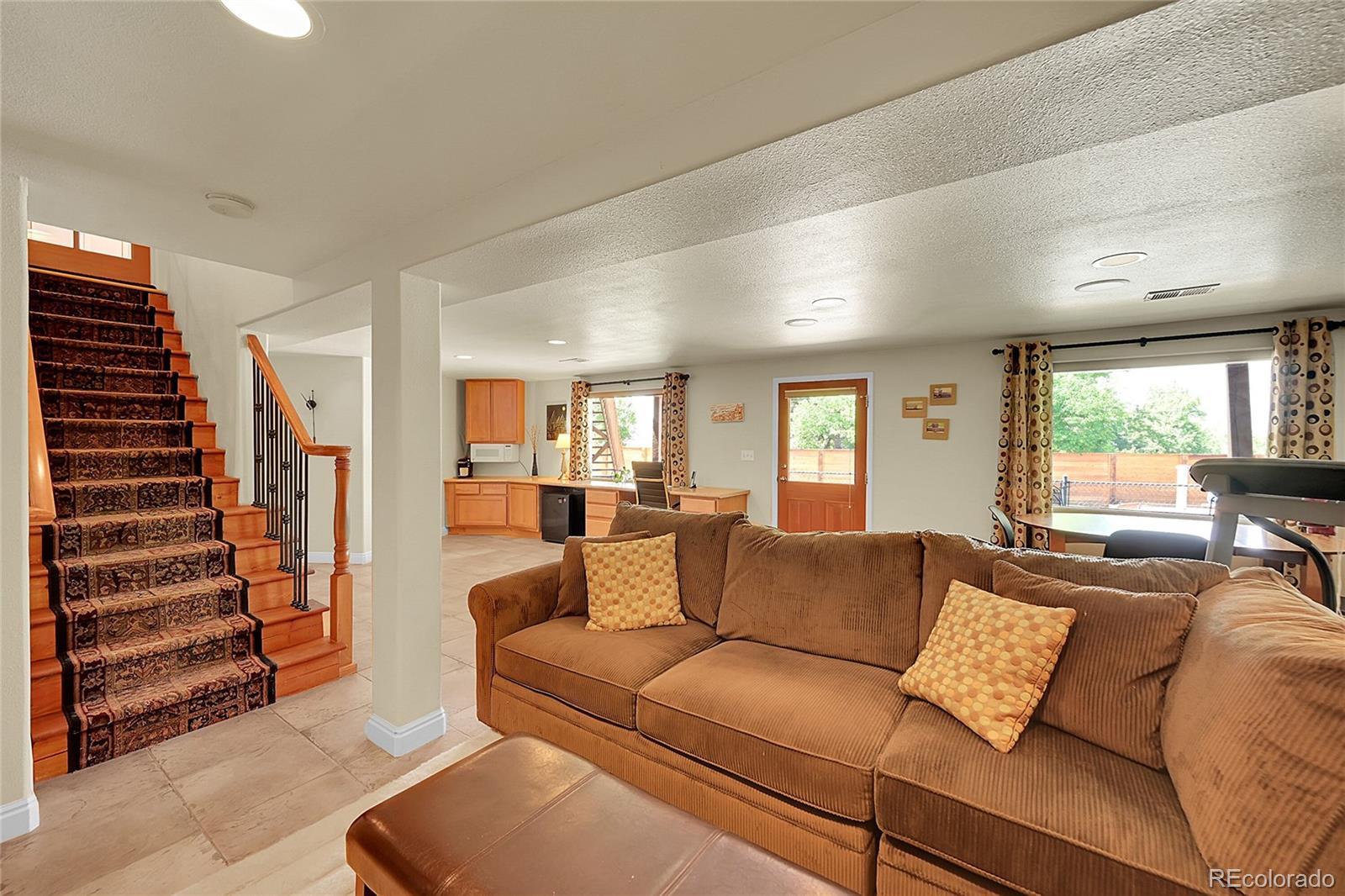 1500 West Ridge Road Littleton, CO 80120 - Photo 21 of 49 a living room with furniture and a large window