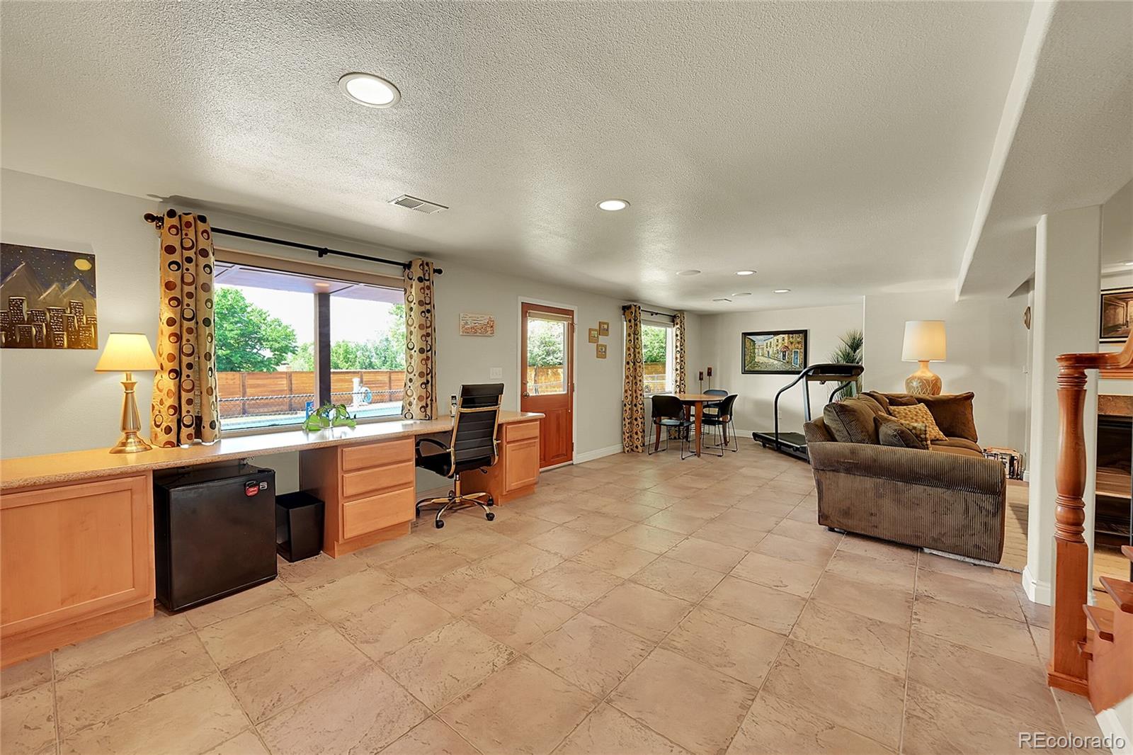1500 West Ridge Road Littleton, CO 80120 - Photo 22 of 49 a living room with furniture window and a table