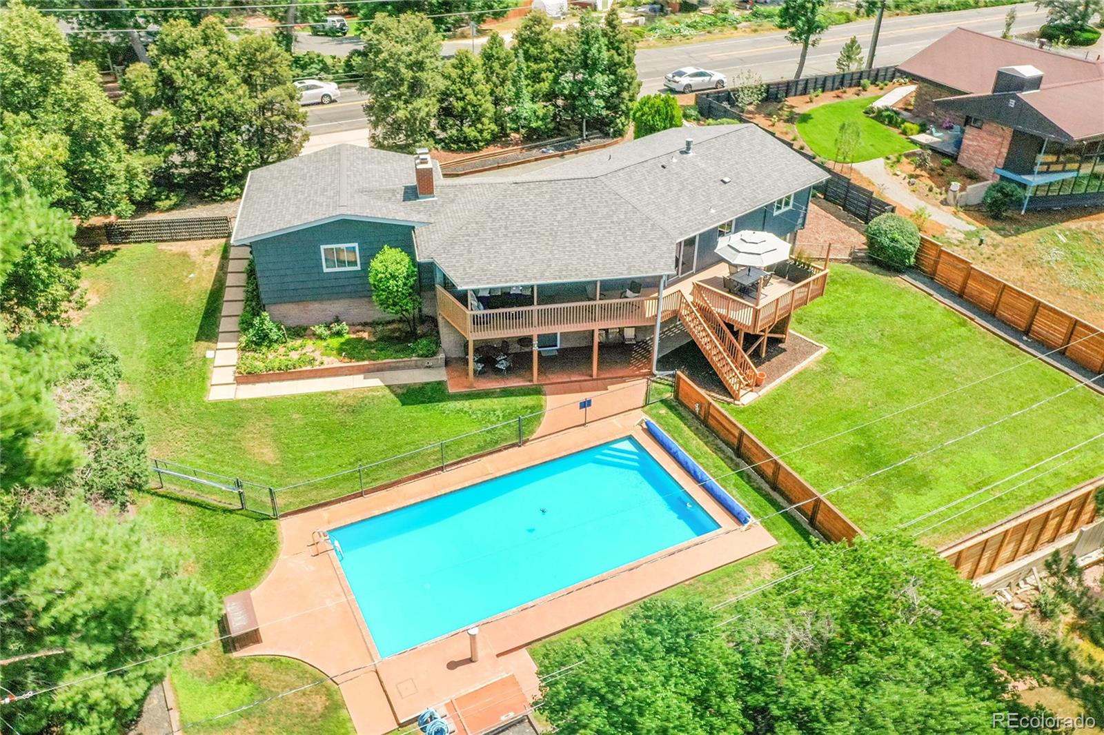 1500 West Ridge Road Littleton, CO 80120 - Photo 30 of 49 an aerial view of a house with swimming pool
