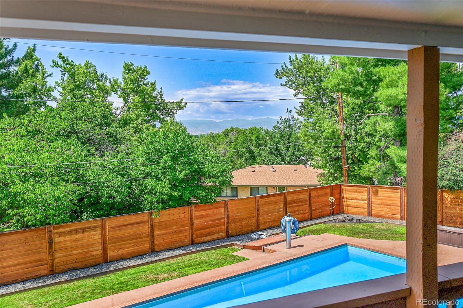 1500 West Ridge Road Littleton, CO 80120 - Photo 35 of 49 a backyard view with sitting space and garden view