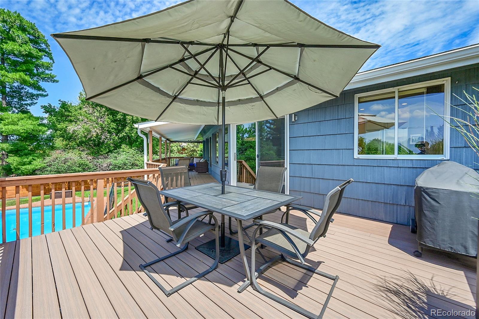 1500 West Ridge Road Littleton, CO 80120 - Photo 37 of 49 a view of backyard with seating space and wooden floor