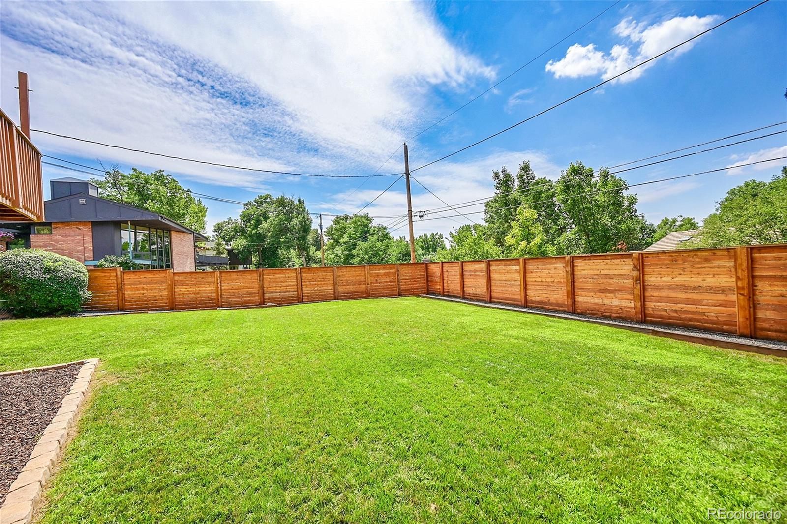 1500 West Ridge Road Littleton, CO 80120 - Photo 38 of 49 a view of a backyard with a garden and plants