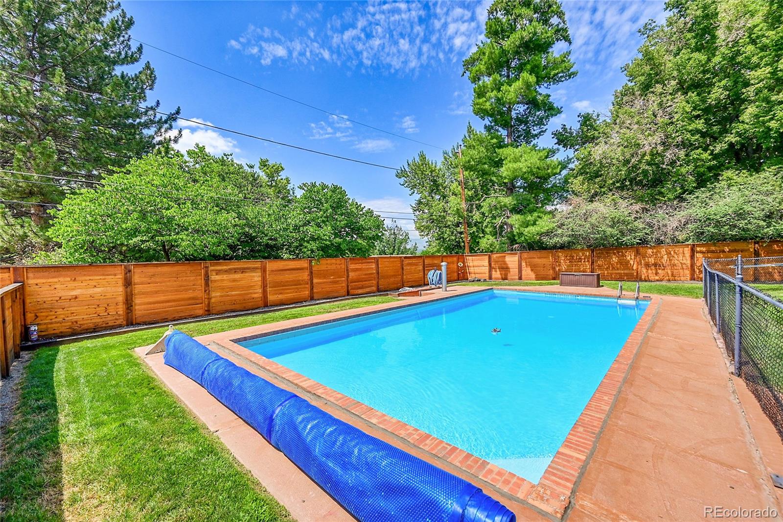 1500 West Ridge Road Littleton, CO 80120 - Photo 40 of 49 a view of a backyard with swimming pool