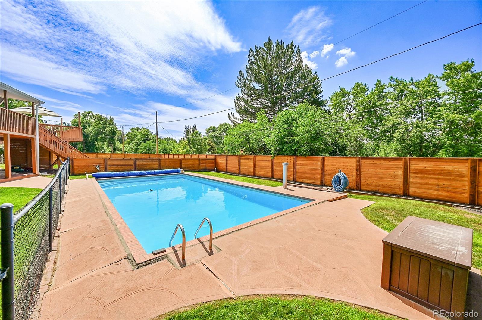 1500 West Ridge Road Littleton, CO 80120 - Photo 41 of 49 a view of a swimming pool with a patio