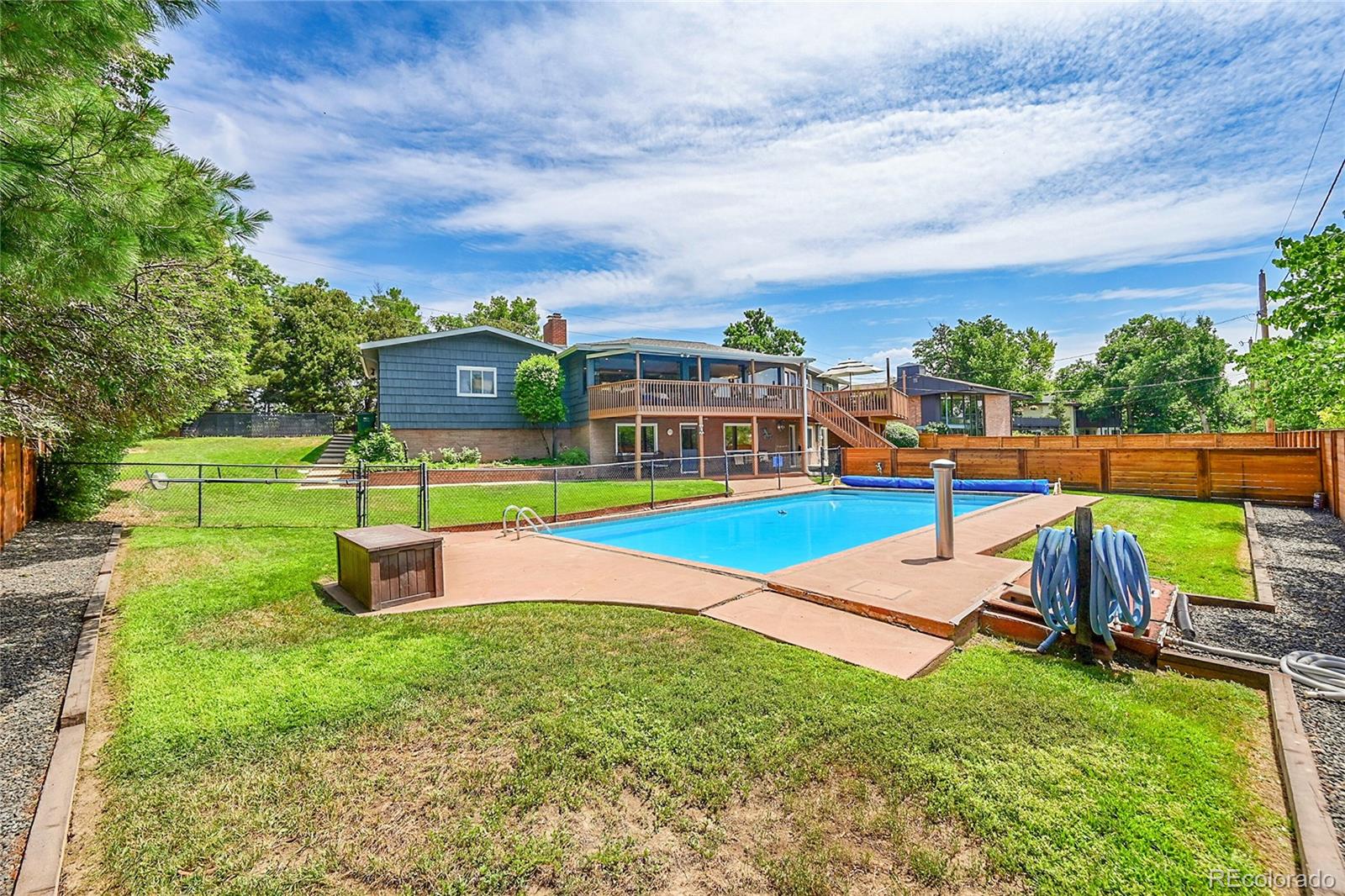 1500 West Ridge Road Littleton, CO 80120 - Photo 42 of 49 a view of a backyard with swimming pool