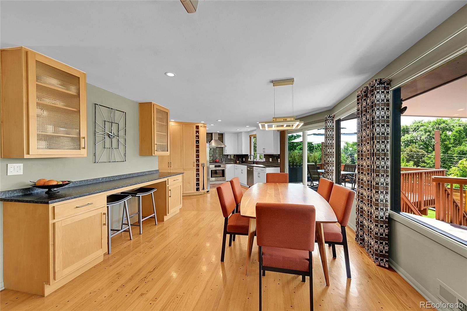 1500 West Ridge Road Littleton, CO 80120 - Photo 5 of 49 a view of a dining room with furniture window and outside view