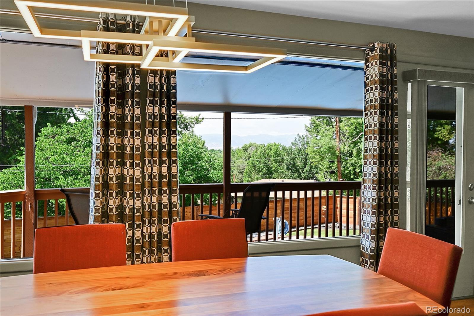 1500 West Ridge Road Littleton, CO 80120 - Photo 9 of 49 a view of a chairs and table in the patio
