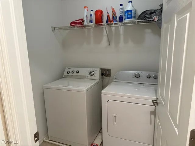 a utility room with dryer and washer