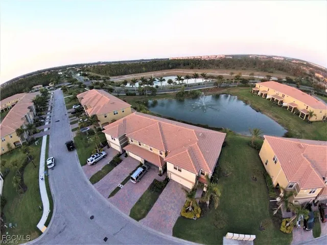 an aerial view of a house with a lake view