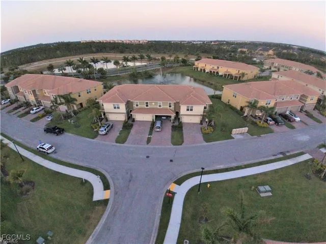 an aerial view of a house with a lake view