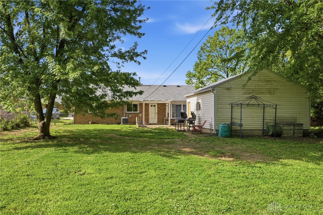 629 Storms Road Dayton, OH 45429 - Photo 47 of 51 This spacious yard features a detached garage and an inviting patio, perfect for outdoor enjoyment.