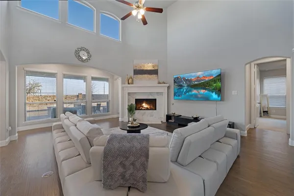 a living room with fireplace furniture and a flat screen tv