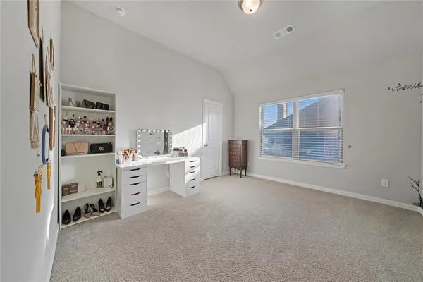 a view of work space with cabinets