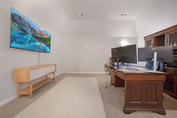 a view of kitchen with sink and refrigerator